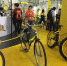 在“小黄车”展台，从左至右展出了萌态“小黄人”单车、怀旧复古的“二八大杠”黄车、轮胎“粗犷”的“肌肉”黄车。这些外表个性的异形共享车已投入多座一线城市。　朱晓颖　摄 - 江苏新闻网