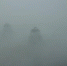 图为秋雾笼罩下的古城扬州若隐若现。　孟德龙　摄 - 江苏新闻网