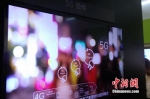 资料图：运营商进行5G技术展示。中新网 吴涛 摄 - 新浪江苏